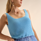 Top in tricot con piume
