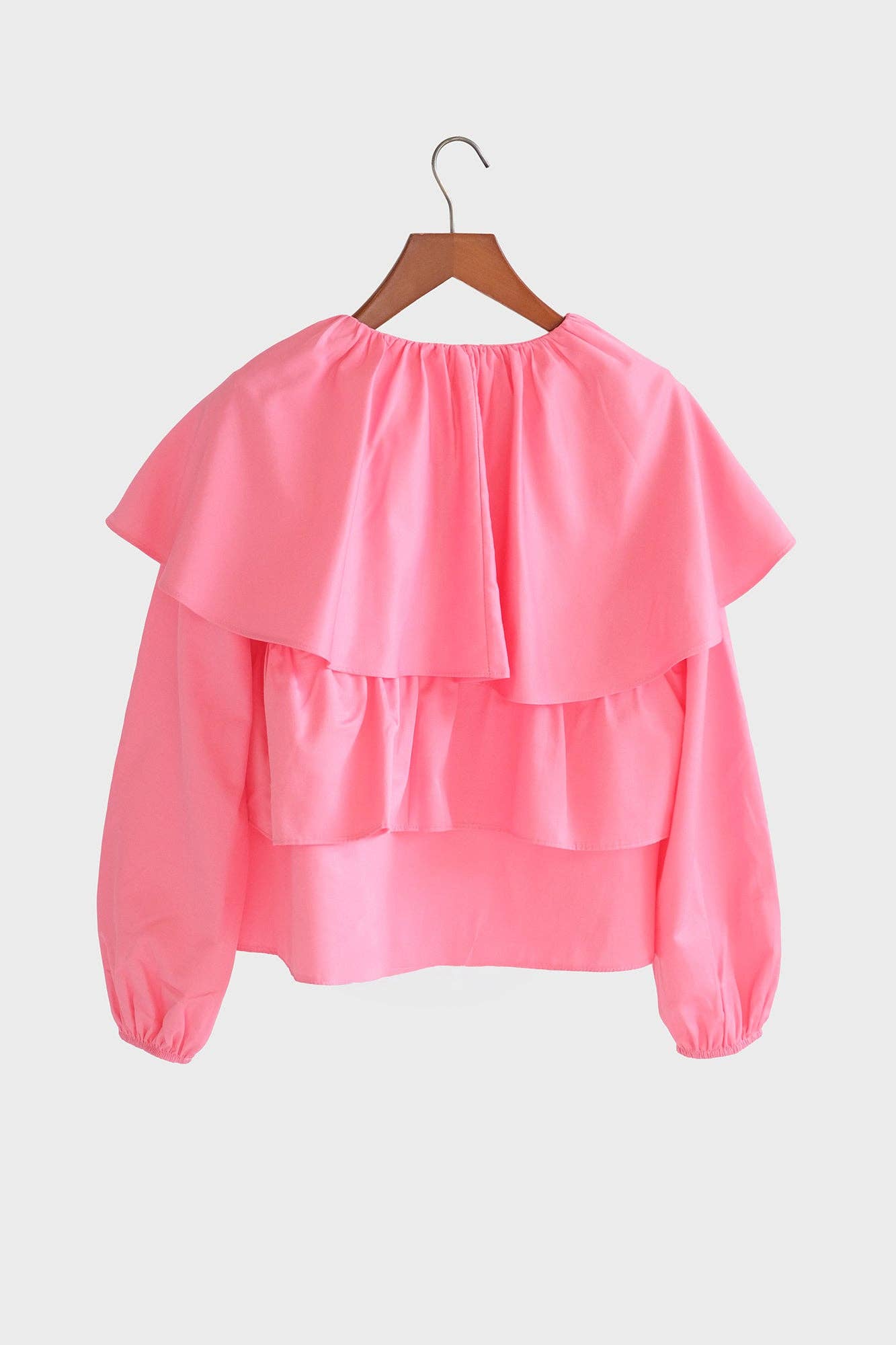 Blusa corta rosa con balze e maniche a sbuffo in misto cotone