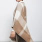 Poncho a quadri con frange
