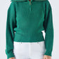 Maglia a costine con zip e collo ampio