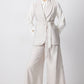 Completo smanicato con gilet cintura e pantaloni palazzo