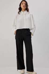 Pantaloni in crêpe con frange