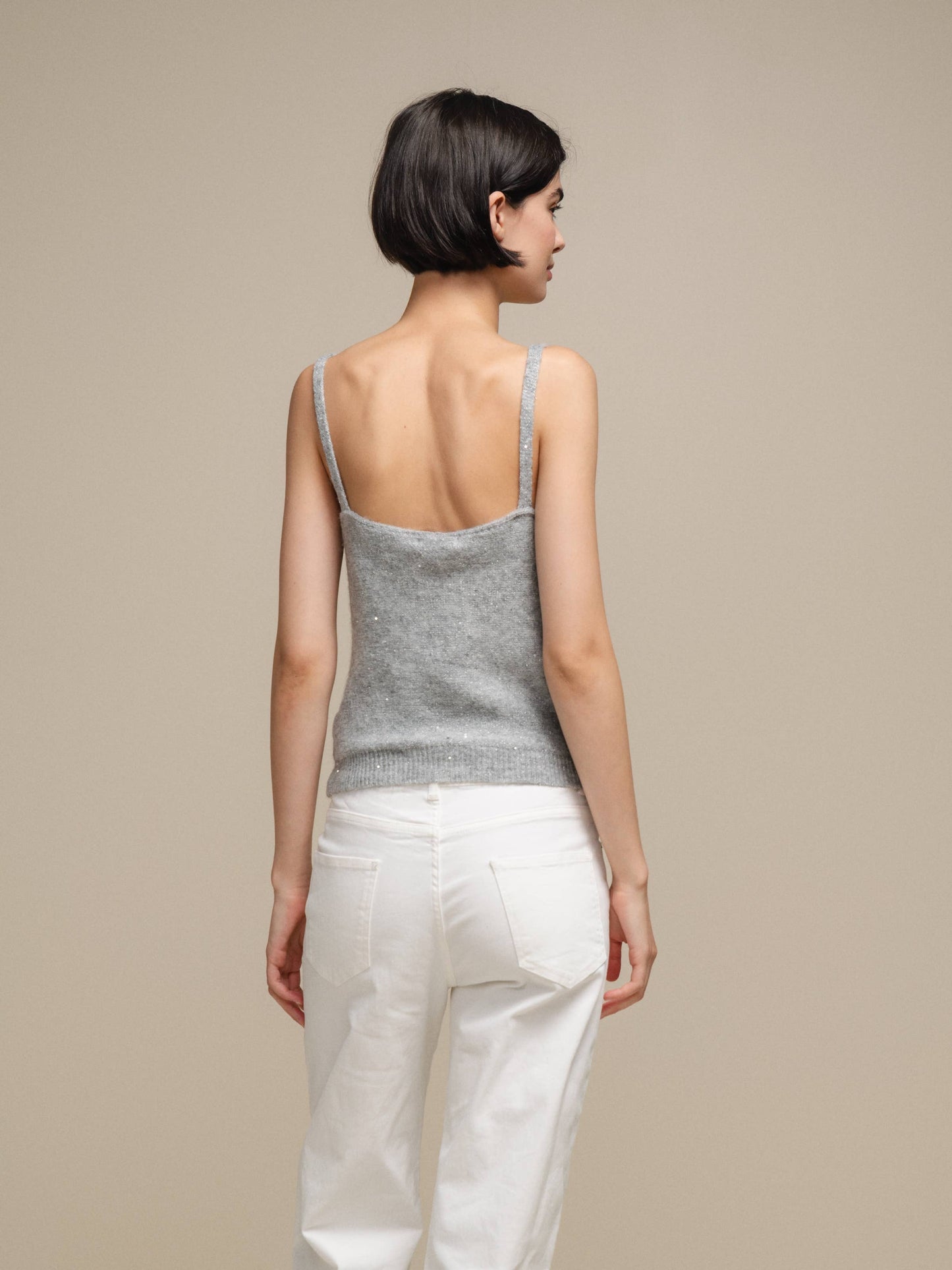 Canotta in maglia lurex versatile con scollo a V