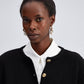 Cardigan nero in maglia con bottoni dorati