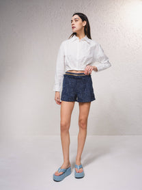 Shorts effetto tweed con catena