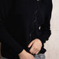 Maglione in maglia scintillante con profilo ondulato