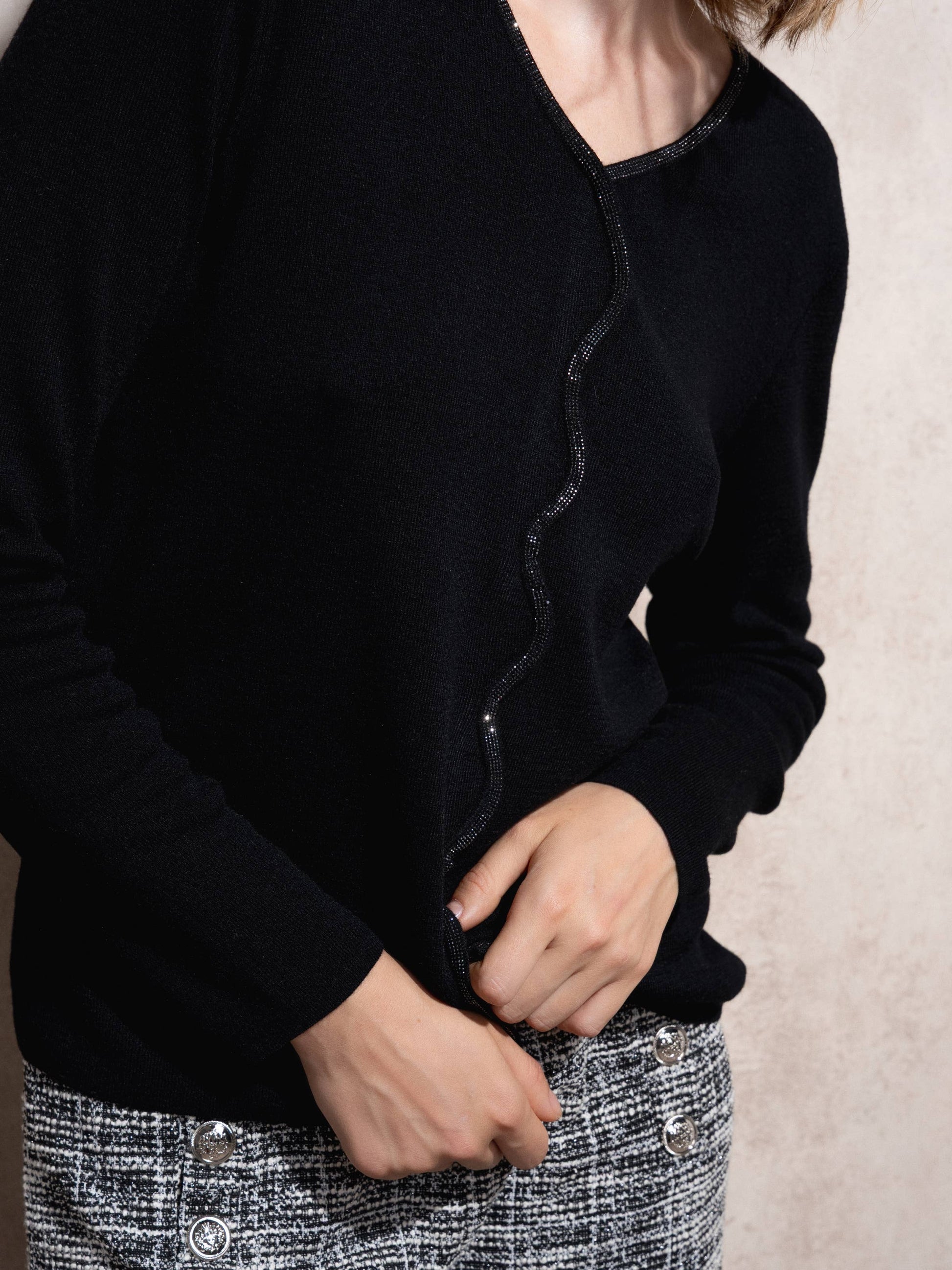 Maglione in maglia scintillante con profilo ondulato