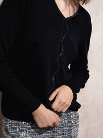 Maglione in maglia scintillante con profilo ondulato