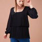 Blusa plissettata nera con scollo squadrato