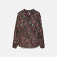 Blusa floreale con laccio al collo