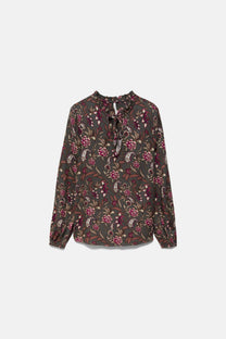 Blusa floreale con laccio al collo