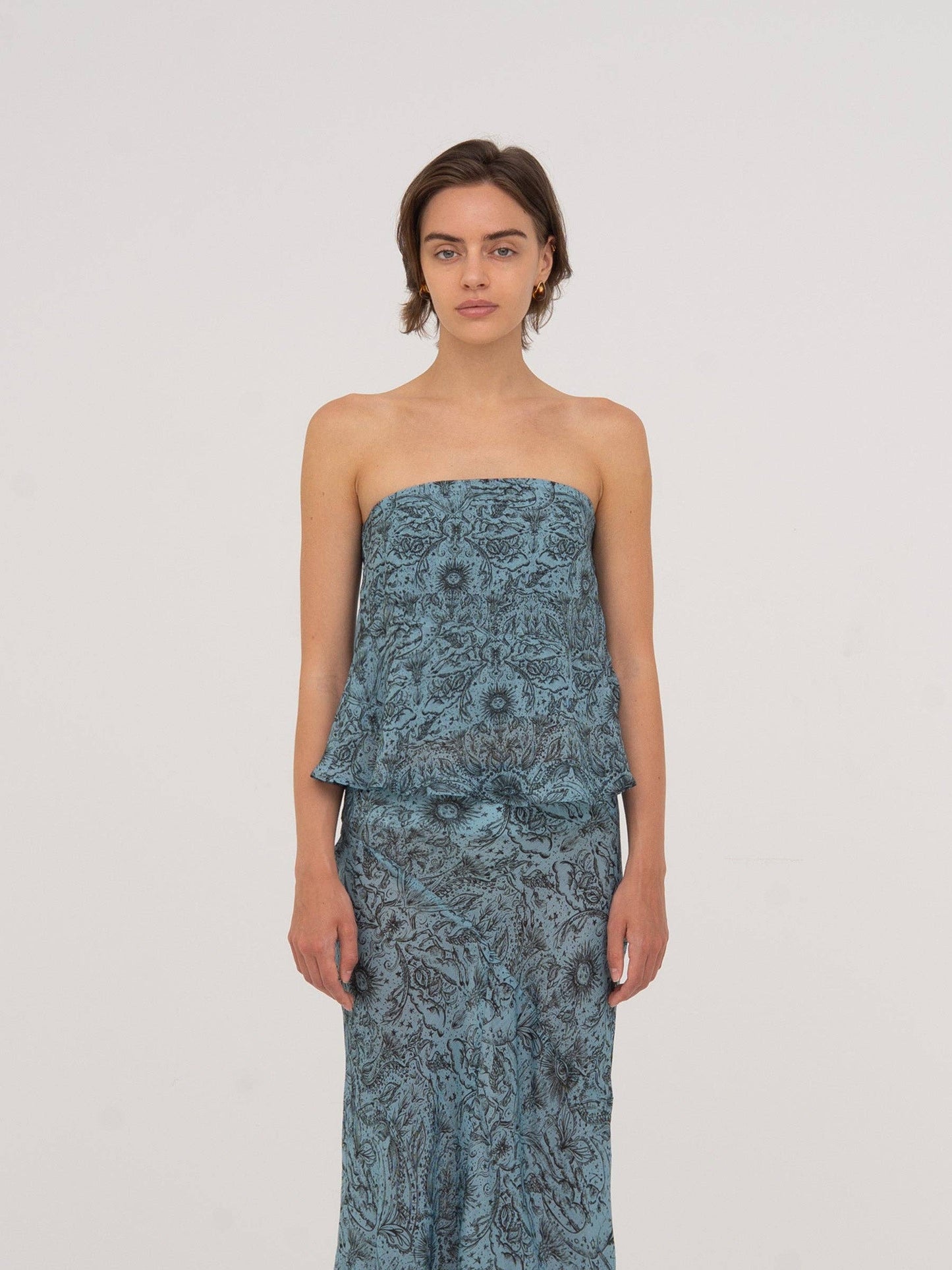 Top a fascia blu con stampa celestiale