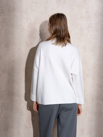 Maglione in maglia con motivo a pois e bottoni ai polsi