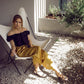 Pantaloni midi palazzo con bottoni laterali