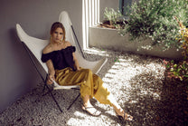 Pantaloni midi palazzo con bottoni laterali