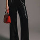Pantaloni a palazzo con paillettes