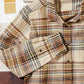 Camicia slim a quadri color latte con tasca