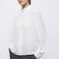 Blusa minimal con collo alto