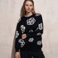 Maglione donna nero con maxi fiori a contrasto