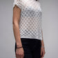 Top corto in crochet traforato dal fit ampio