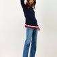 Maglione con balze e nastri a contrasto