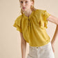 Blusa in lino con volant