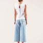Blusa bianca con volant e fiocco sul retro