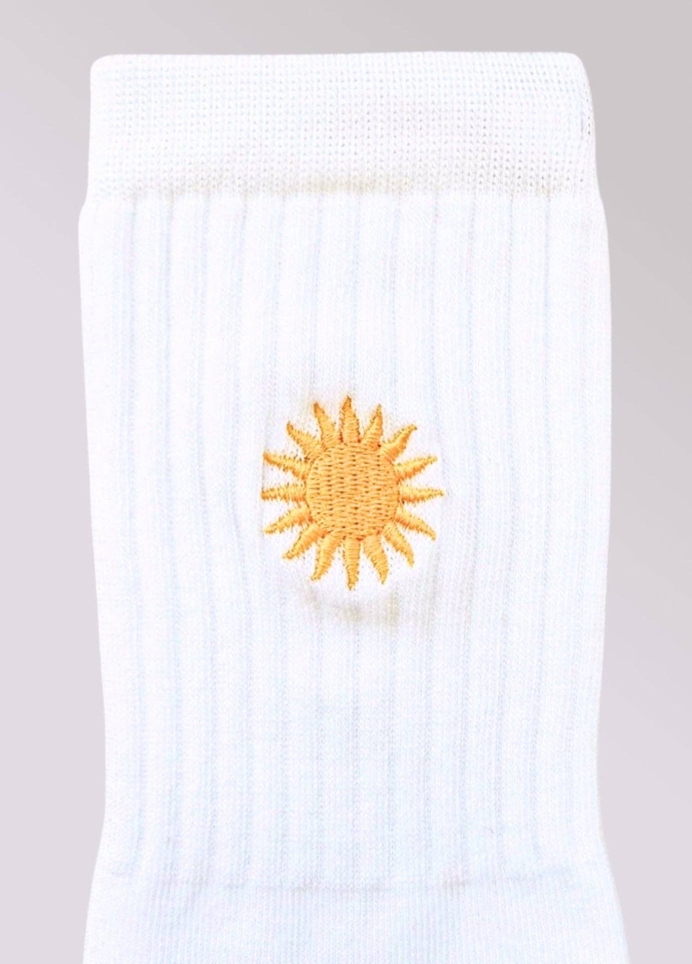Calze bianche con ricamo sole