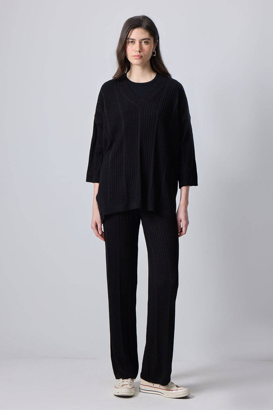 Completo in maglia nero con tunica e pantaloni