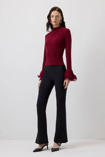 Blusa in maglia con maniche a balze in chiffon trasparente