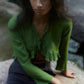 Blusa corta verde con fiocchi e volant