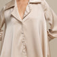 Tunica satinata oversize con bottoni