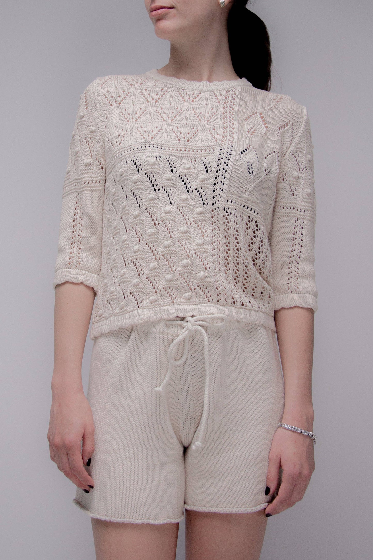 Maglia traforata in cotone con motivo floreale