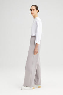 Pantaloni a vita alta in crepe elasticizzato a gamba larga