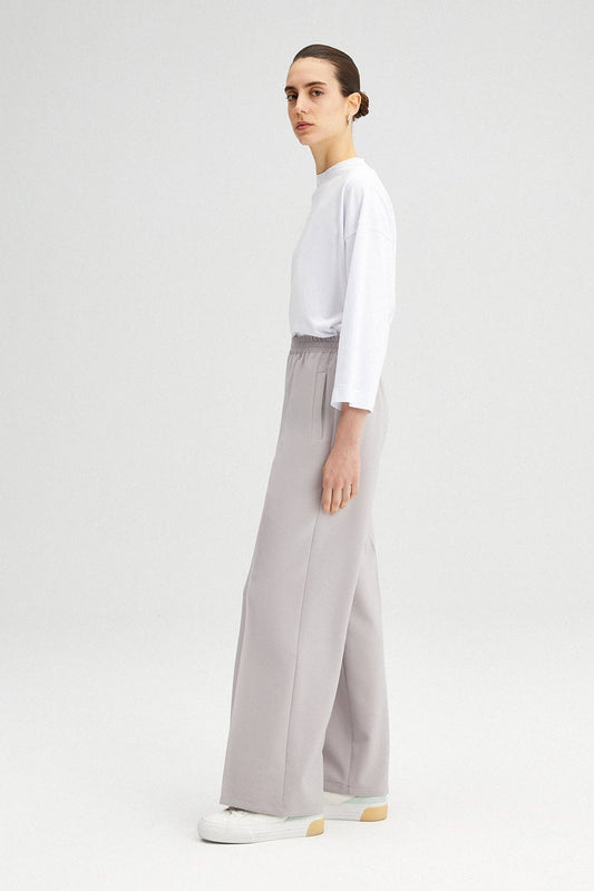 Pantaloni a vita alta in crepe elasticizzato a gamba larga