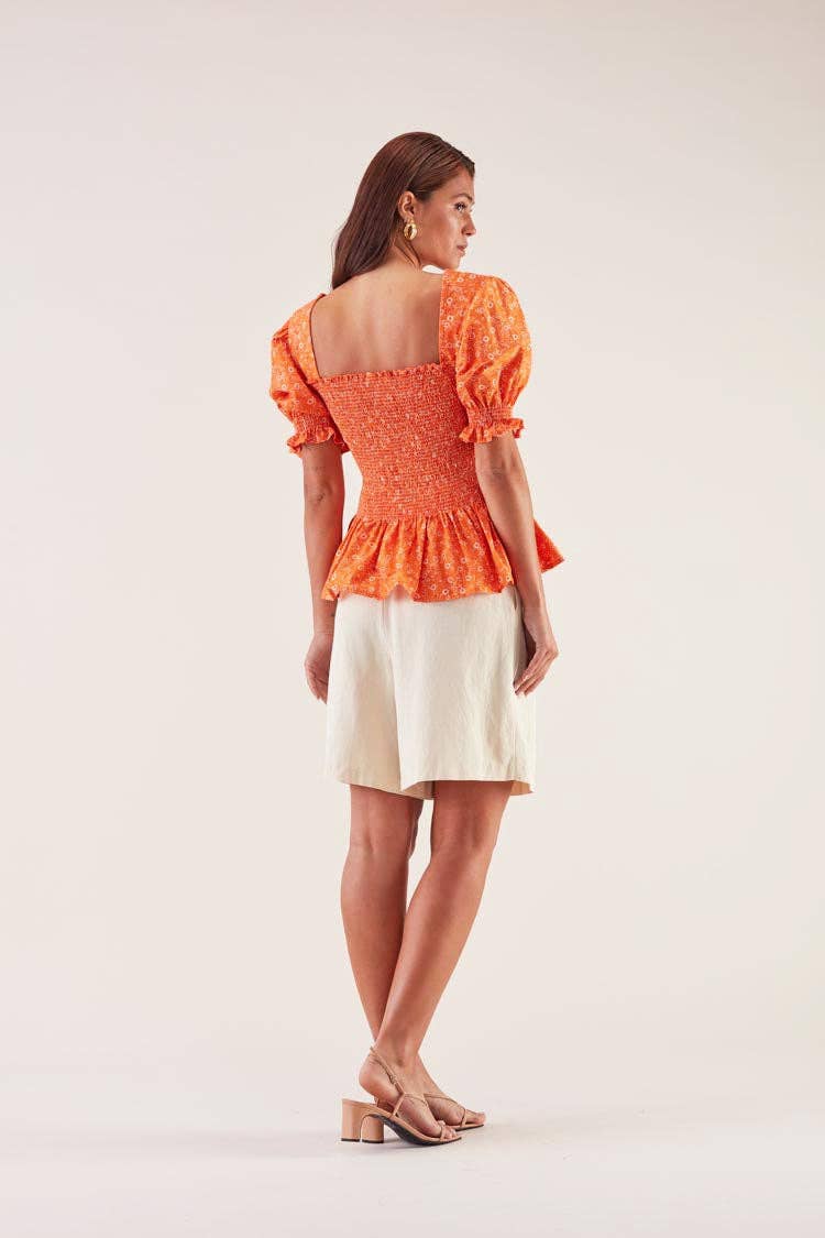 Blusa elasticizzata arancione a maniche a sbuffo