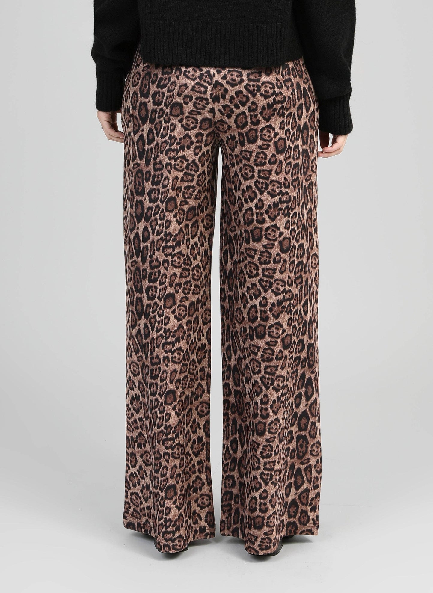 Pantaloni a zampa animalier vita alta
