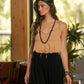Top in maglia con profili intrecciati