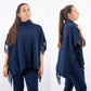 Poncho in maglia con frange e collo alto