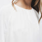 Blusa con pieghe sulle maniche