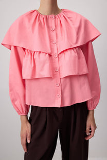 Blusa corta rosa con balze e maniche a sbuffo in misto cotone