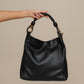 Borsa hobo in ecopelle con manico intrecciato