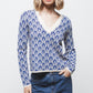 Maglione jacquard con motivo geometrico e scollo a V