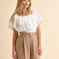 Blusa in sangallo con ricamo e scollo elasticizzato