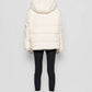 Piumino in eco shearling con cappuccio removibile