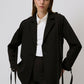 Blazer nero con dettagli metallici