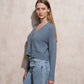 Cardigan corto in maglia con scollo a V e tasche