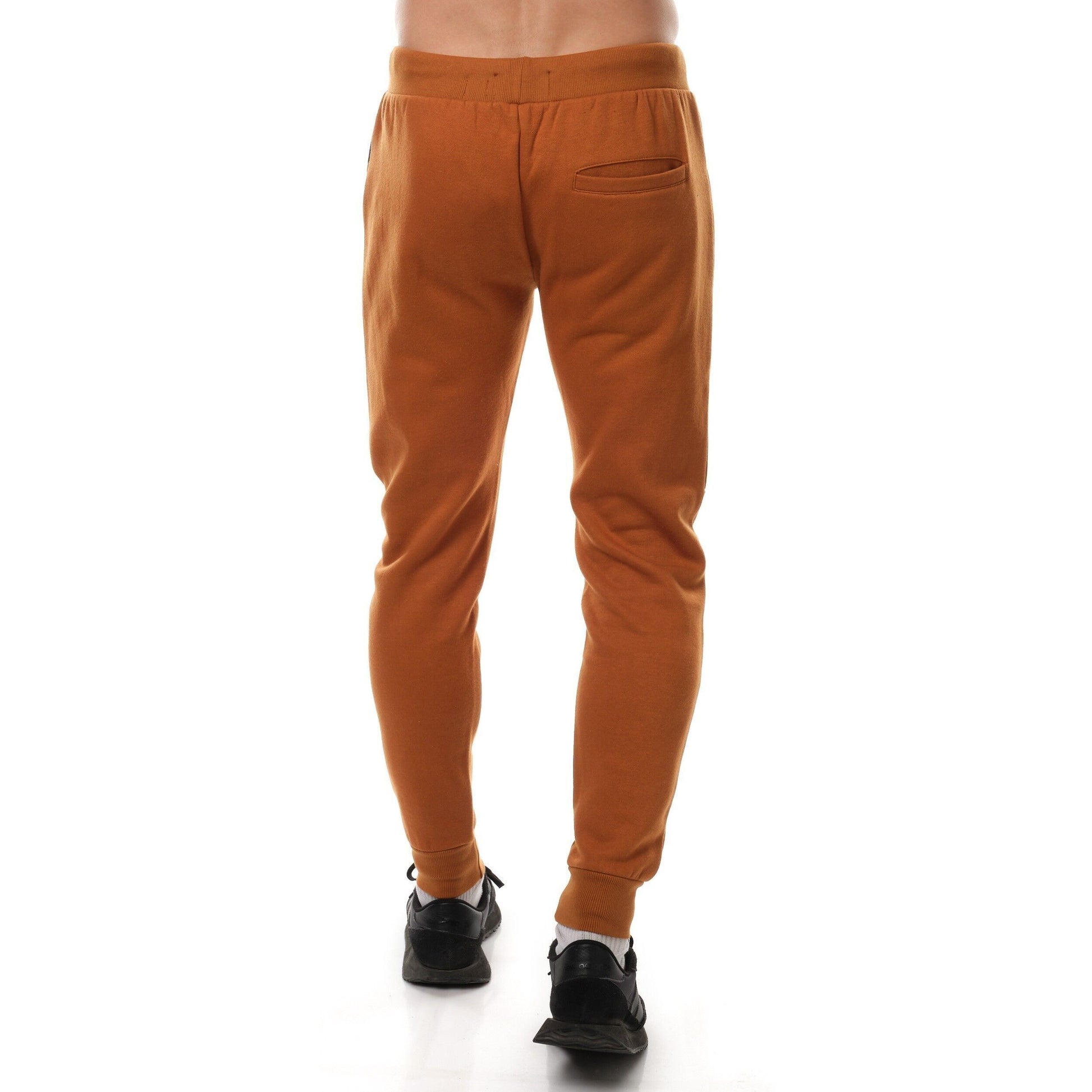 Pantaloni jogger in pile bicolor nero e beige da uomo