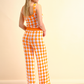Pantaloni in maglia a fantasia arancio e bianco