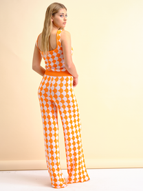 Pantaloni in maglia a fantasia arancio e bianco